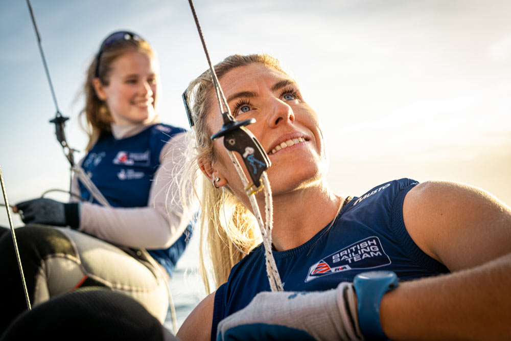 dramatic closeup of Saski sailing with her partner