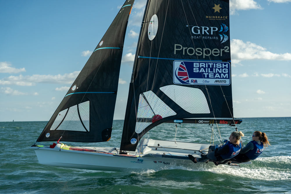 Freya sailing on the open sea with her sailing partner on a sunny day